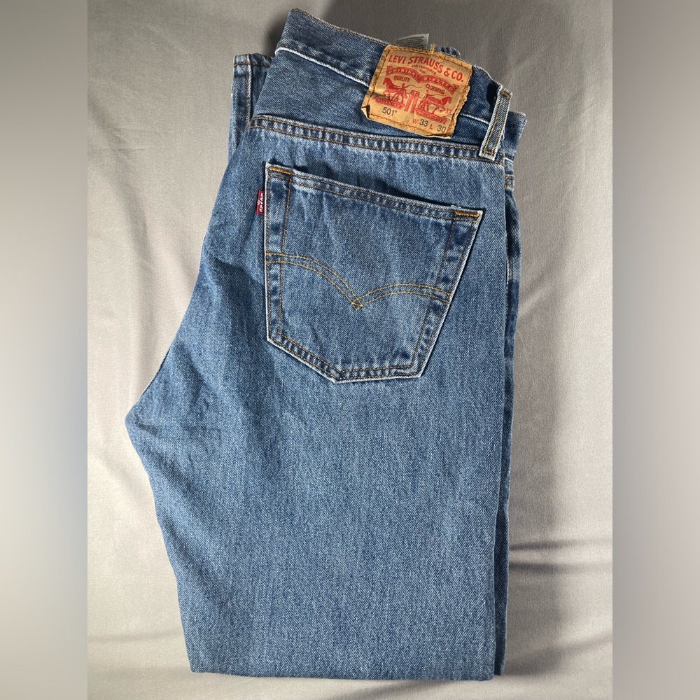 Vintage Levi's Men's Straight Jeans in Denim Blue. Button Up